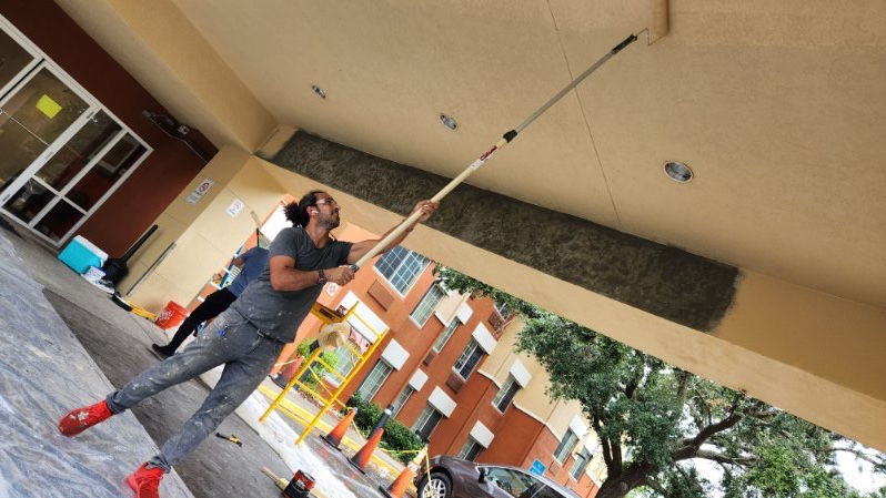 Friends Construction team painting for a home renovation project