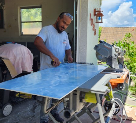 Hussein cutting marble tile for a renovation project