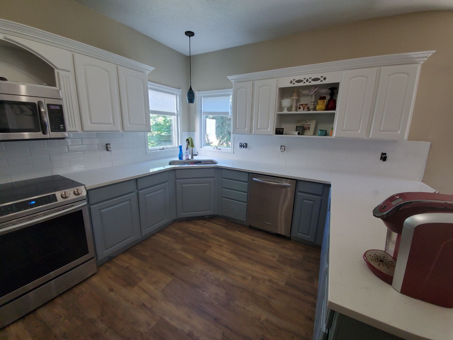 Modern kitchen remodel with marble countertops and custom cabinetry