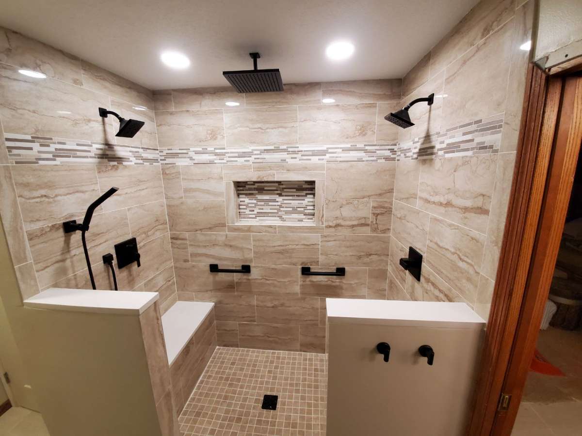 Spa-like bathroom renovation with marble shower and custom vanity