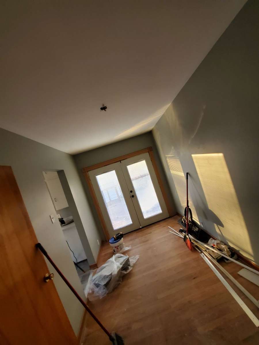 Open concept living room renovation with custom built-ins